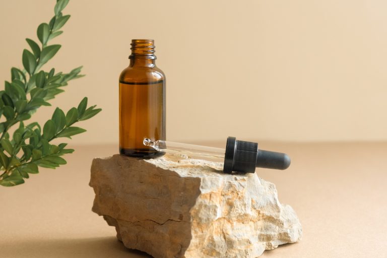 A bottle of cosmetic liquid, hyaluronic acid or serum