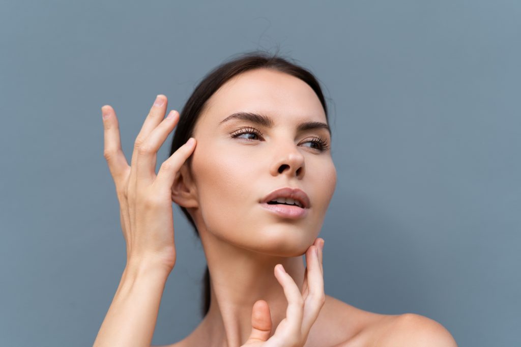 Beauty portrait of woman with perfect skin and natural makeup, full nude lips