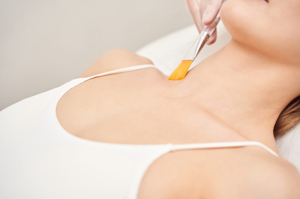 Cosmetology beauty procedure. Young woman skin care. Beautiful female person